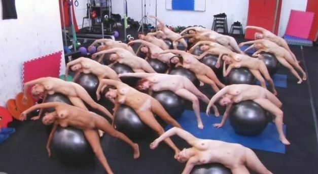 The big group of girls of nudists is engaged in aerobics in the sports hall - Purenudism video [Pure naturism]